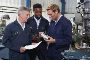 46133866 - team of engineers having discussion in factory