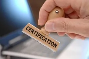 15356785 - rubber stamp in hand marked with certification